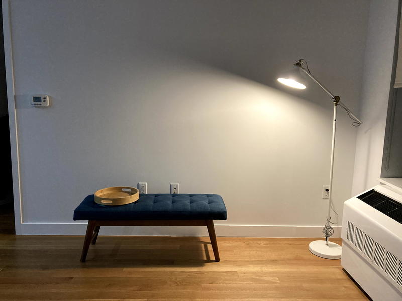 New apartment with small bench and lamp