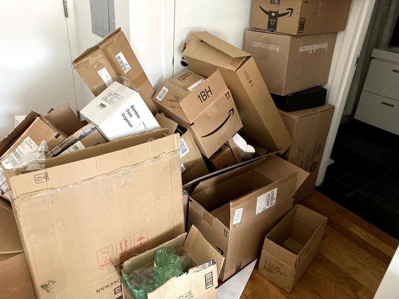 A pile of boxes in a room.