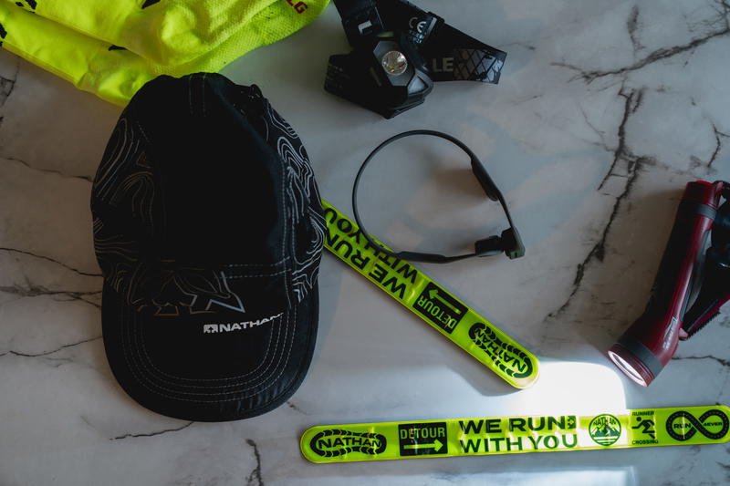 A hat, gloves, and other items are laid out on a marble table.