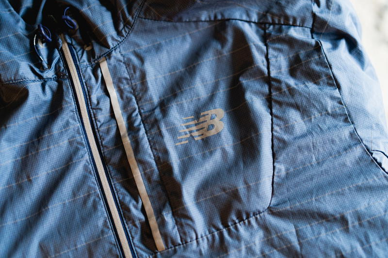 A close up of a blue jacket with a logo on it.