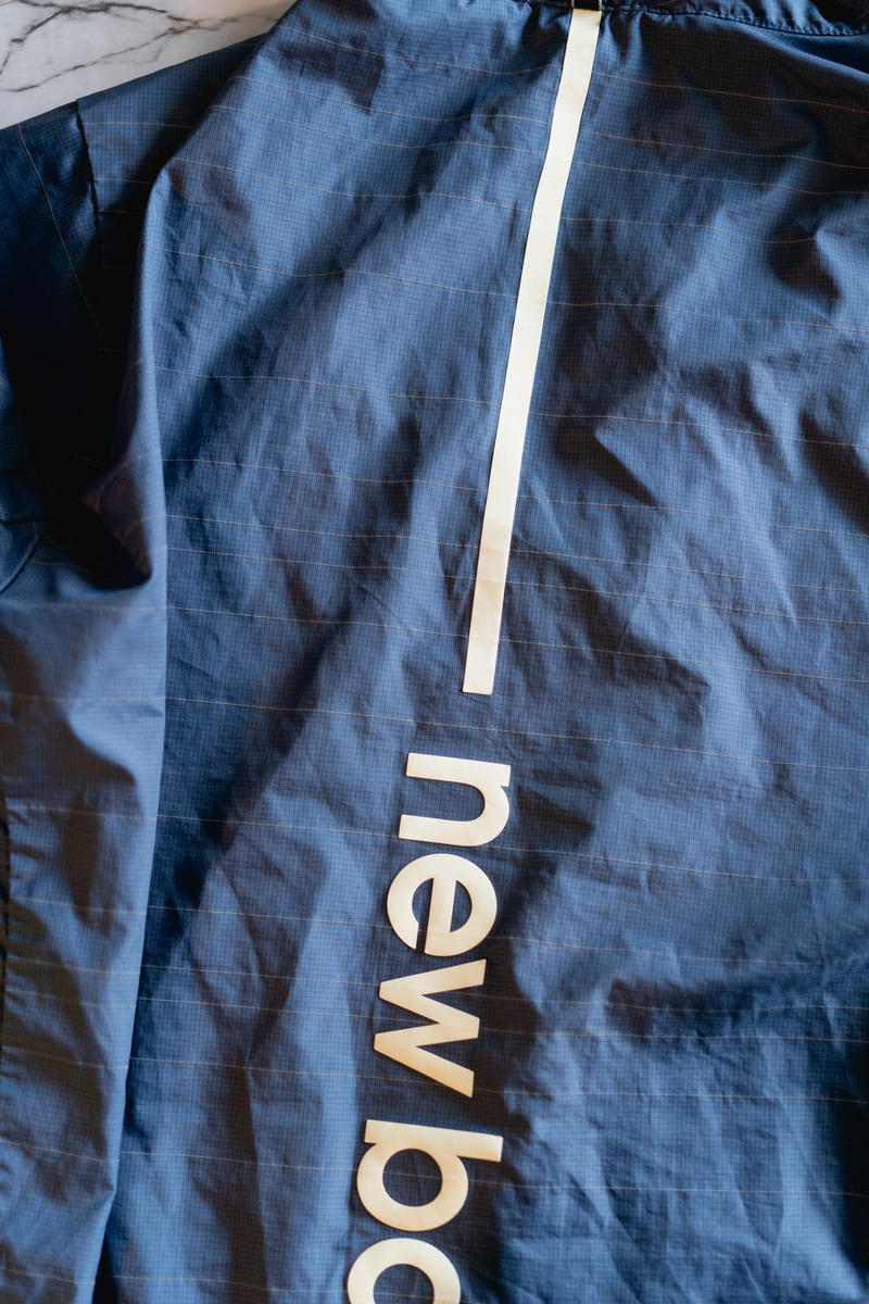 A blue jacket with the words new balance on it.