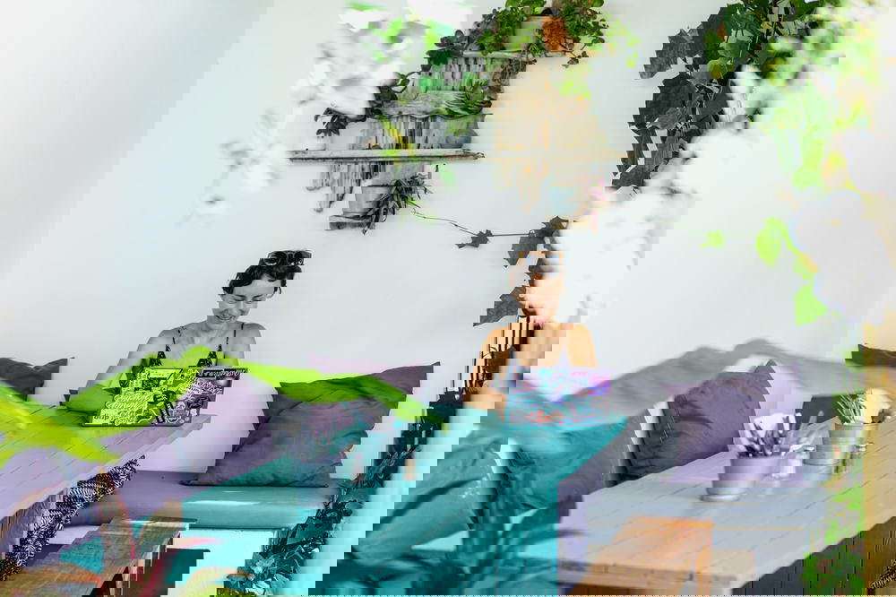 Woman using Dell XPS on a team table outside at a cafe