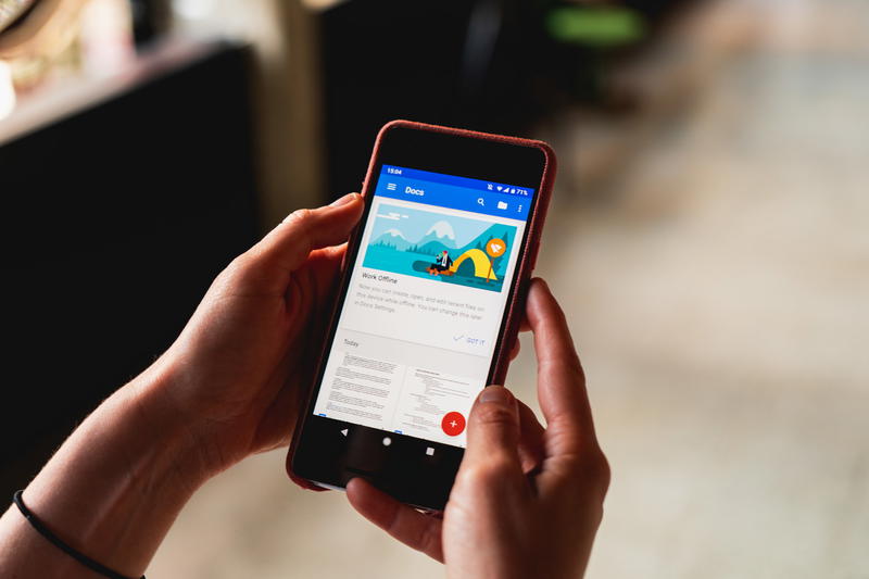 Woman's hands holding a Google Pixel phone with an app open